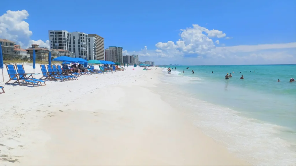 Rows of beach chairs and umbrellas on the white-sand beach in Destin, Florida